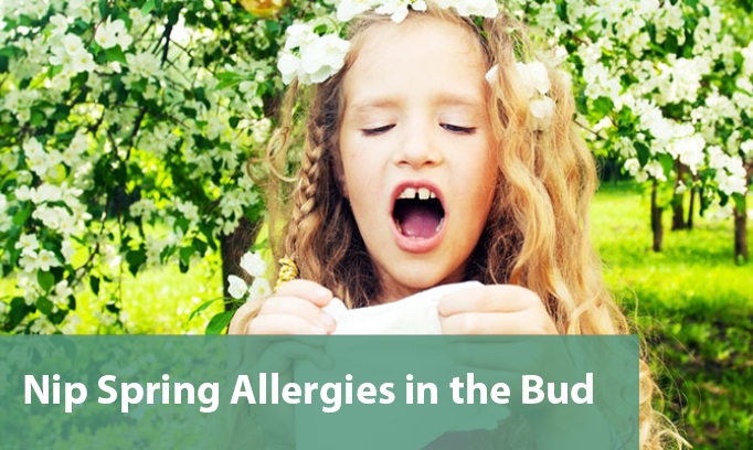 young girl holding flowing trying not to sneeze